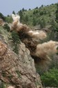 Blasting of rock to remove potential hazards as part of the mitigation. thumbnail image