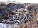 Erosion in the drainage has lead to exposure of utility lines. thumbnail image