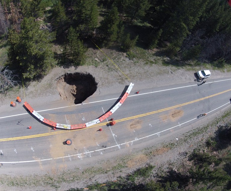 This sinkhole developed when a 100 year old abandoned railroad tunnel collapsed.