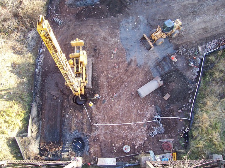 View from the old bridge looking down on the new caisson foundations being drilled.