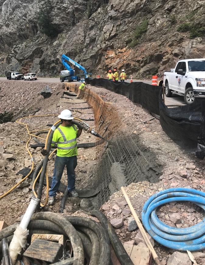 Filling steel posts and mesh with concrete.jpg detail image