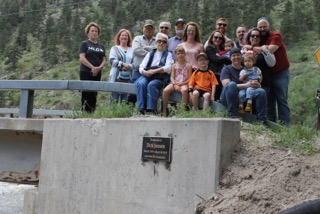 Members of the Jensen family dedicate a plaque