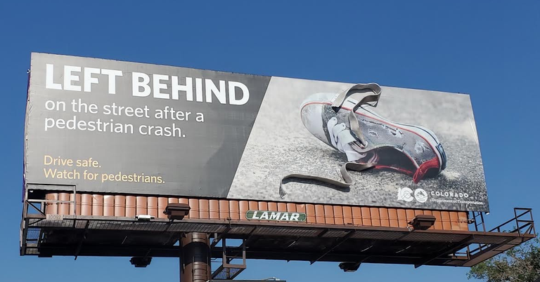 Billboard photo of shoe with message "left behind on the street after a pedestrian crash. Drive Safe Watch for Pedestrians."