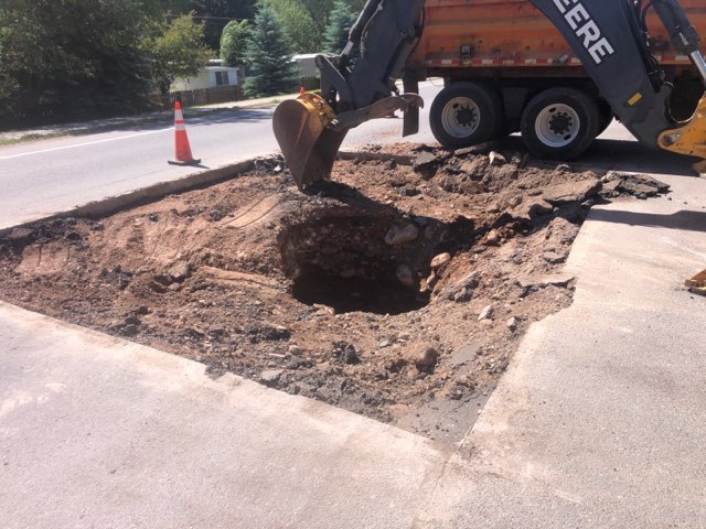 Carbondale sink hole close up with tractor detail image