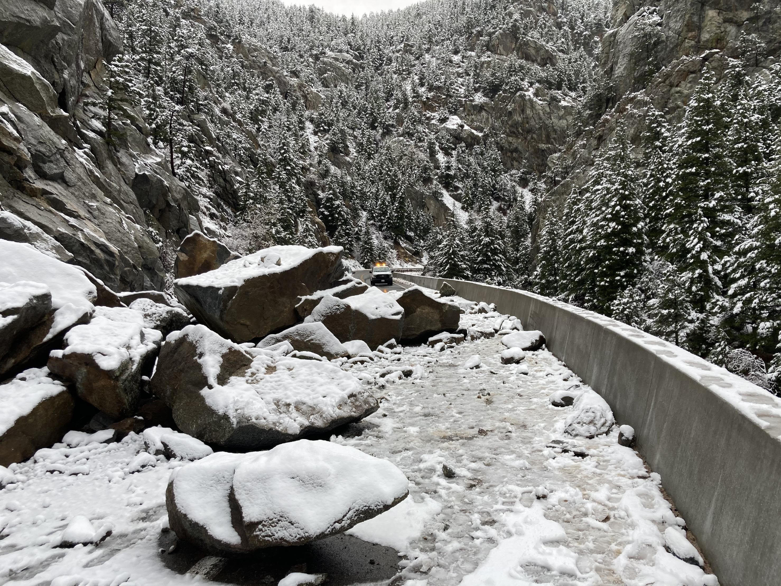 Rockfall on roadway in Boulder Canyon during snow detail image