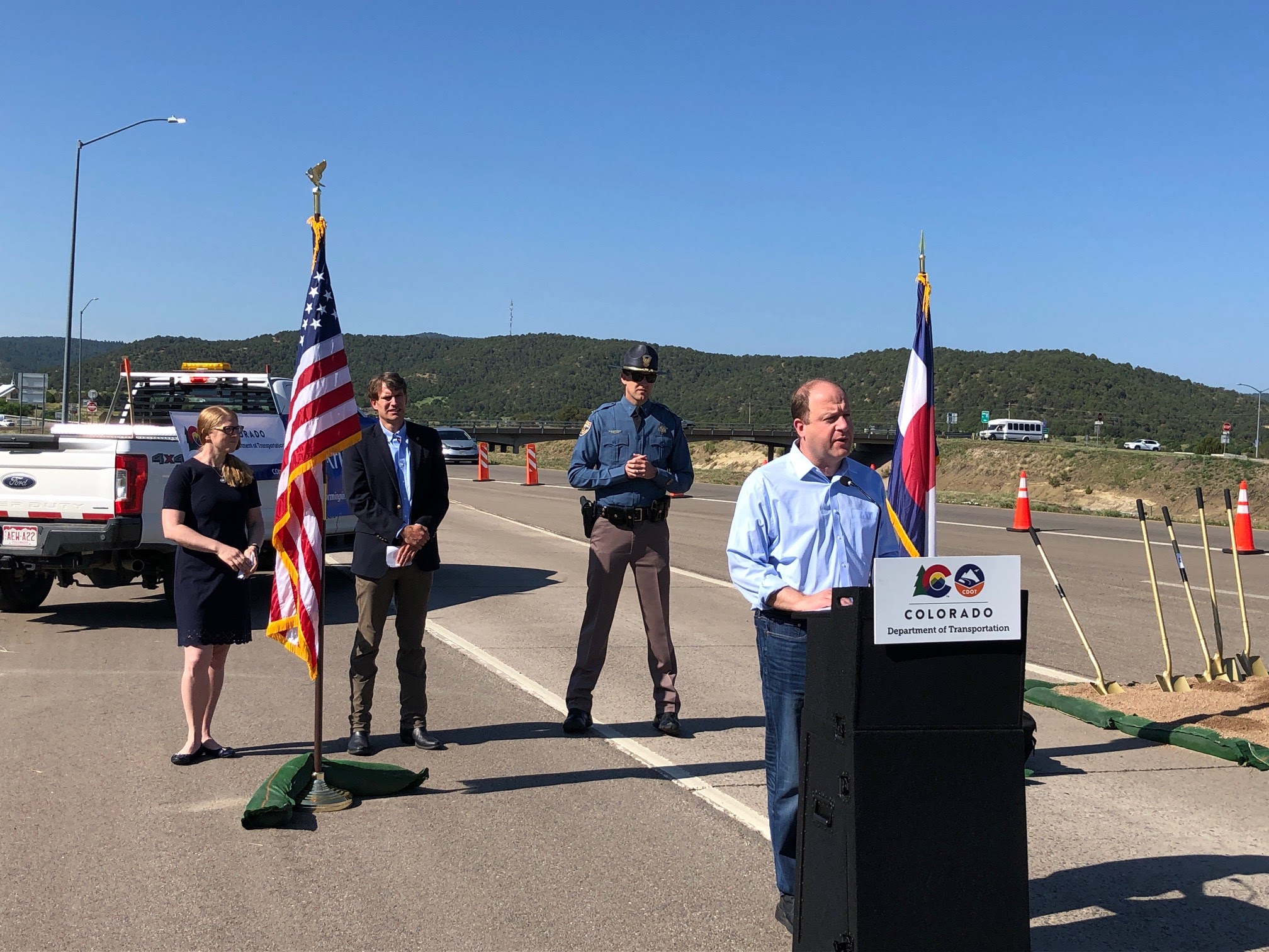 Governor Polis and Director Lew speaking at groundbreaking for the I-25/Exit 11 Interchange Improvement project detail image