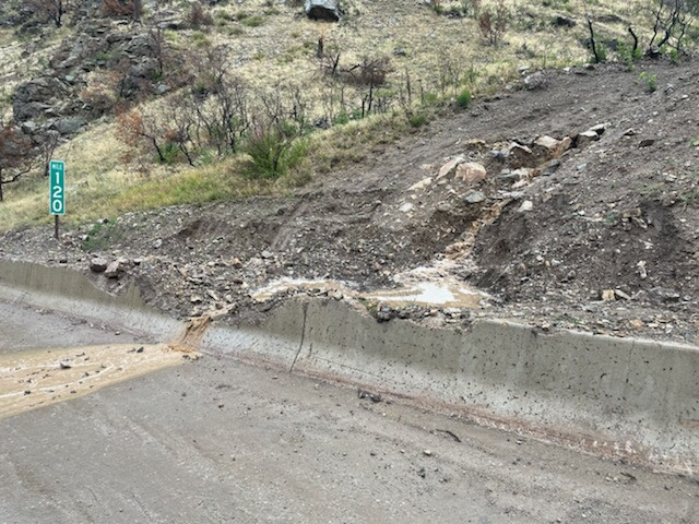 Glenwood Canyon mudslide over damaged guardrail detail image