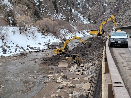 Tractor working to clear the river alongside I-70 Glenwood Canyon detail image
