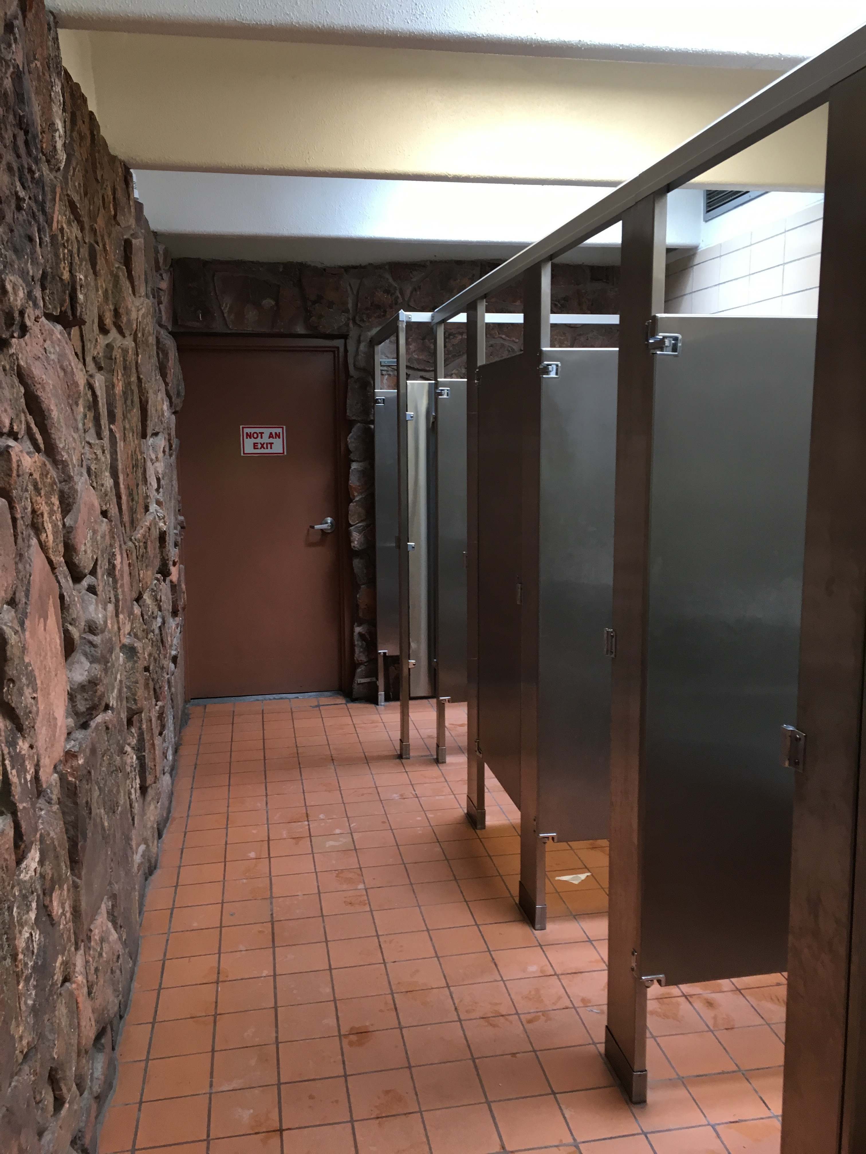Pueblo rest area bathroom stalls detail image