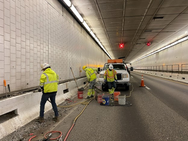 Construction crews on the Eisenhower Johnson Memorial Tunnel repairs project detail image