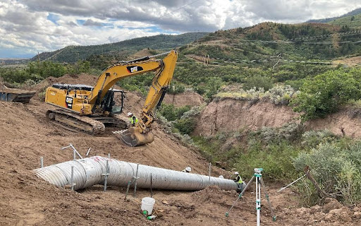 Metal pipe being installed by CDOT crews on CO 13 detail image
