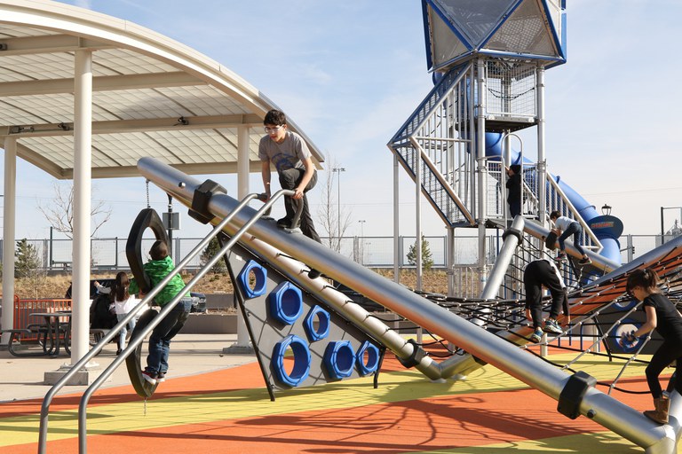 Children playing in the newly constructed Central 70 park. 