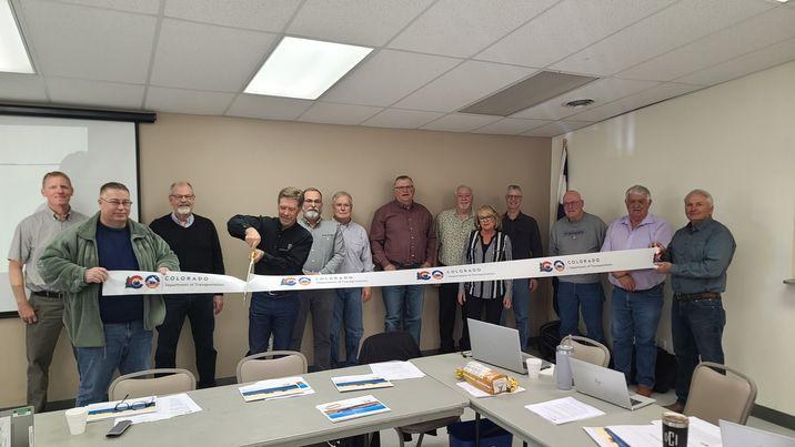 Gary Beedy, Transportation Commissioner, cutting the ribbon with members of the Eastern TPR in Akron 