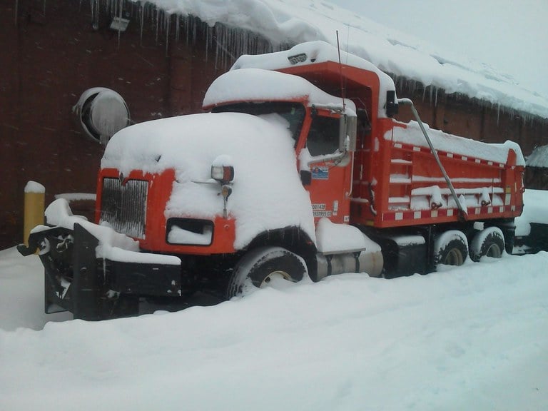 image of snow-covered CDOT maintenance vehicle