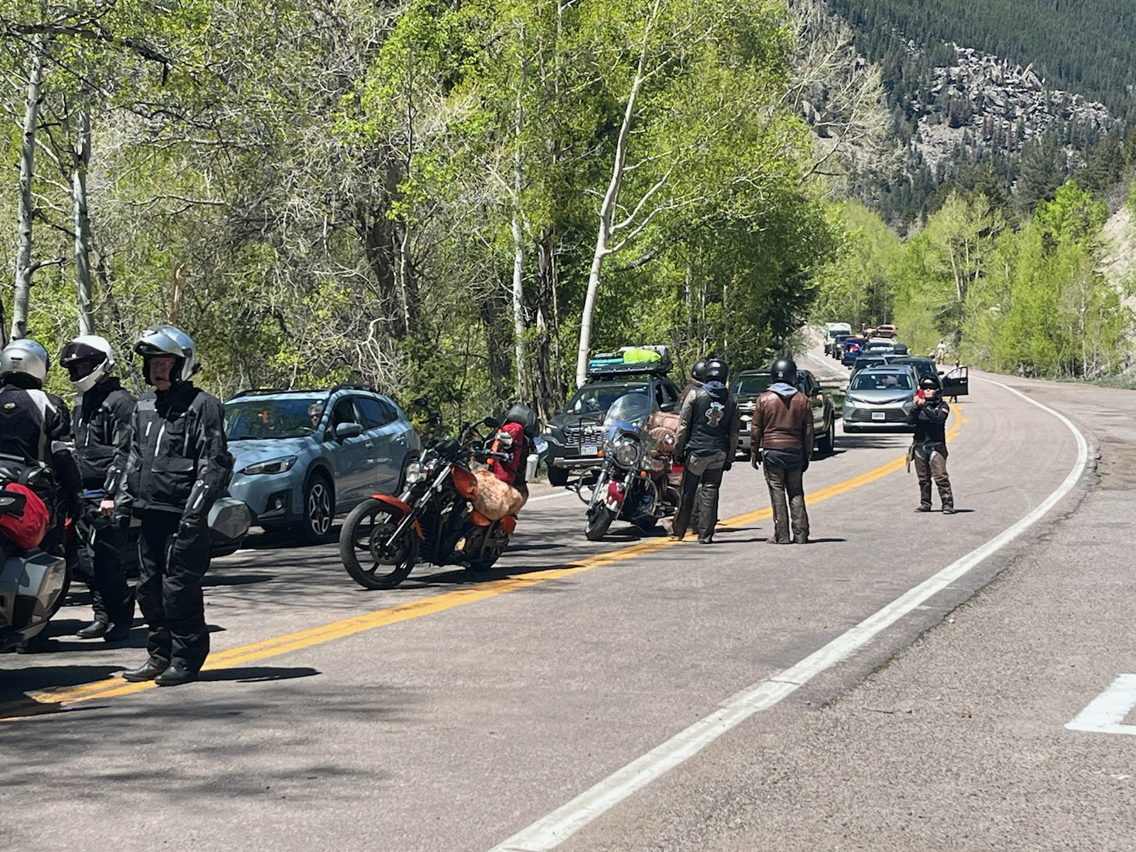 Motorcyclists and traffic on Independence Pass in the springtime detail image