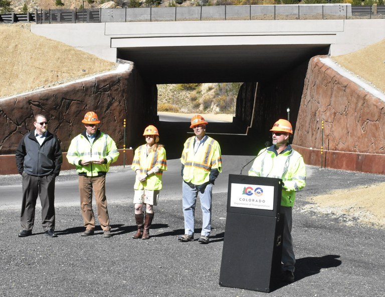 CDOT Region 3 Transportation Director Jason Smith provides spoken remarks.  Also pictured, left to right: Interim Assistant County Manager for Summit County Steve Greer, CDOT Director of Maintenance and Operations John Lorme, CDOT Executive Director Shoshana Lew, and CDOT Chief Engineer Steve Harelson.
