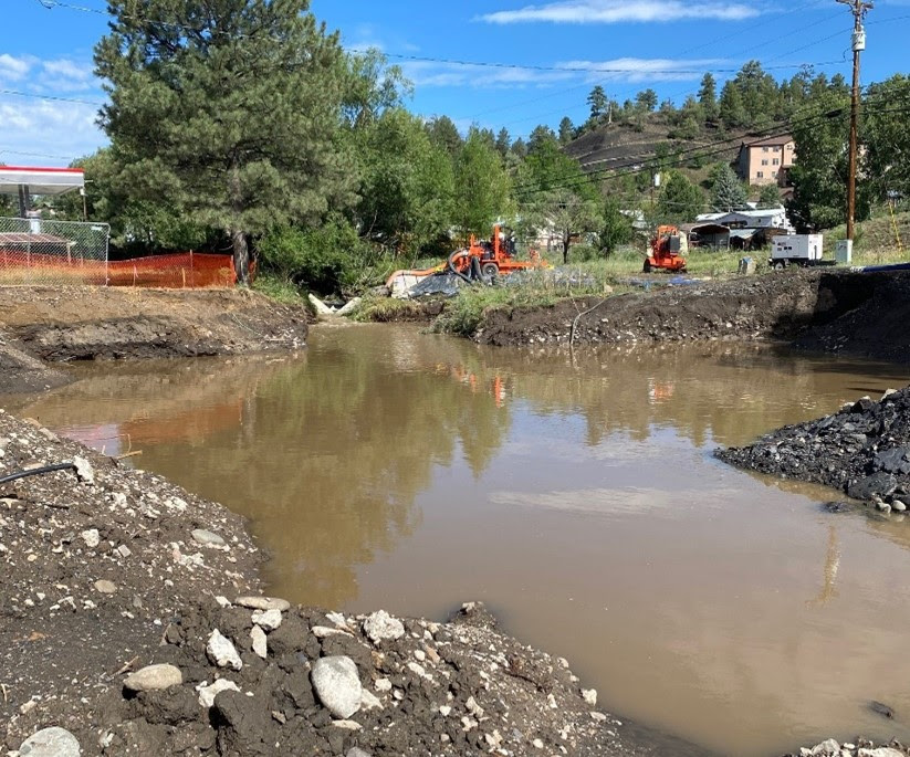 Rainfall filled the McCabe Creek drainage area delaying the removal of the existing culverts and retaining wall detail image