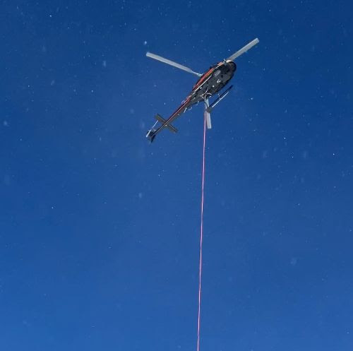 Helicopter hovers above US 160 Wolf Creek Pass with a suspension line.jpg detail image