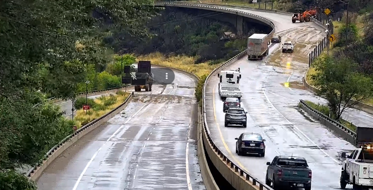 Image of Glenwood Canyon Mudslide cleanup and cars driving on I-70