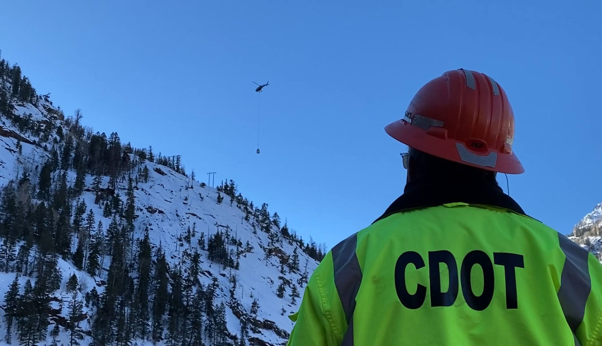 Ave mitigation helicopter and crew member.jpg detail image