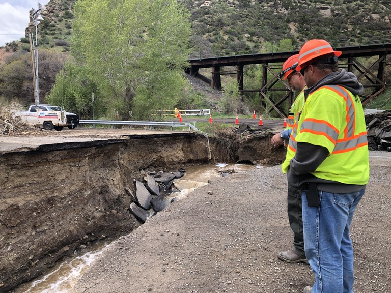 Maintenance Crews Observing Sinkhole Damage