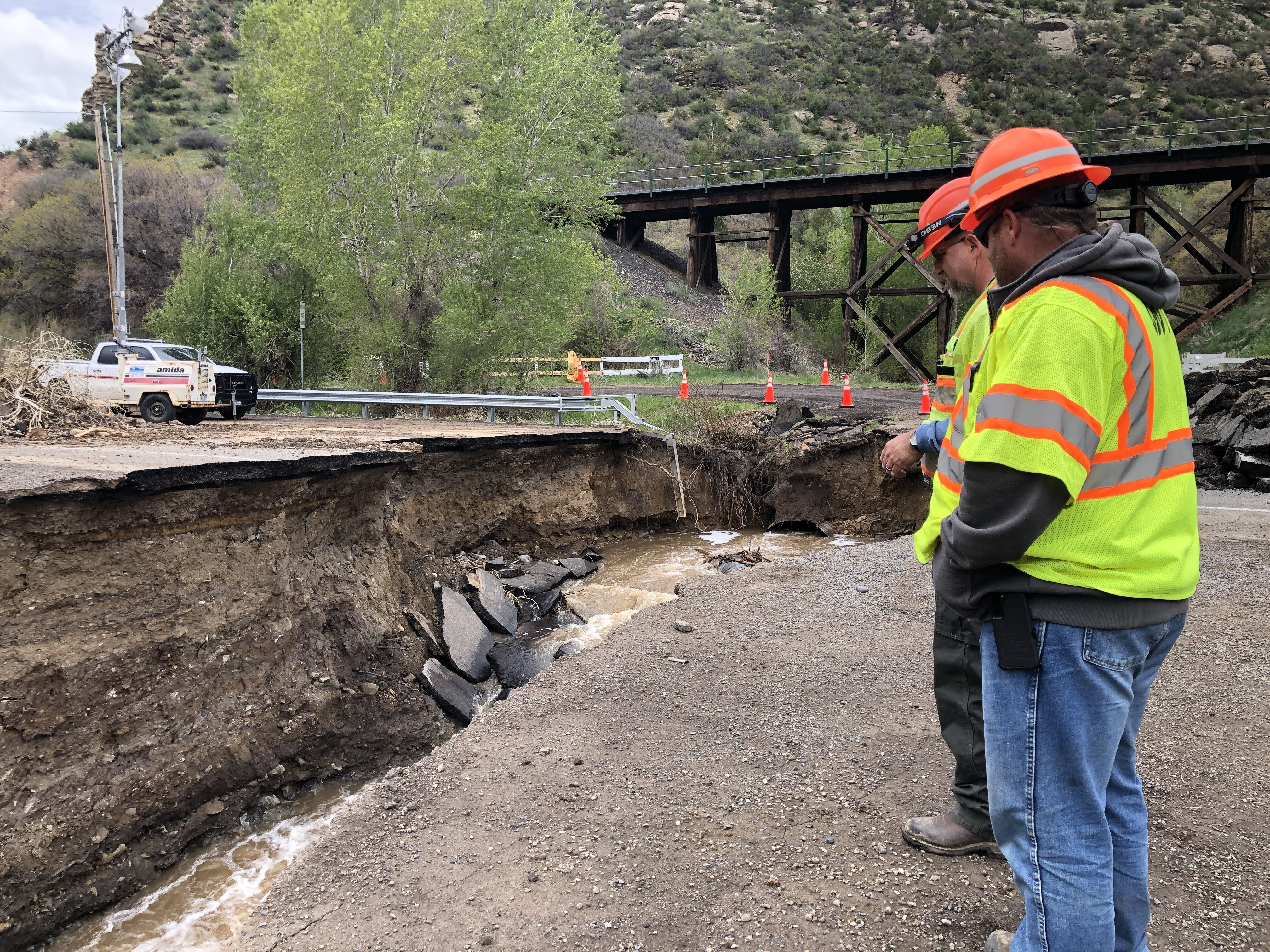 Maintenance crews observing sinkhole damage.jpg detail image