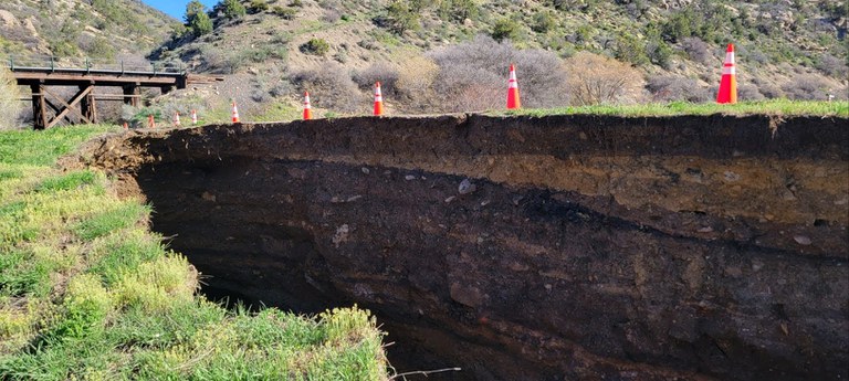 The above photo shows another angle of the sinkhole and related damage. Photo taken morning of May 3.