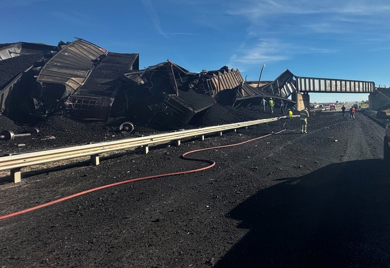 Coal and freight rail cars cover I-25 south of Pueblo