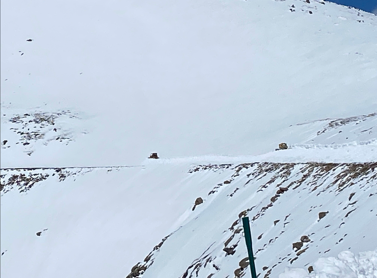 Two snow plows clearing snow on CO 5 going up the summit of Mount Blue Sky