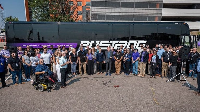 Gov. Jared Polis and CDOT Executive Director Shoshana Lew celebrate the 10-year anniversary with the Bustang team Gov. Jared Polis and CDOT Executive Director Shoshana Lew celebrate the 10-year anniversary with the Bustang team