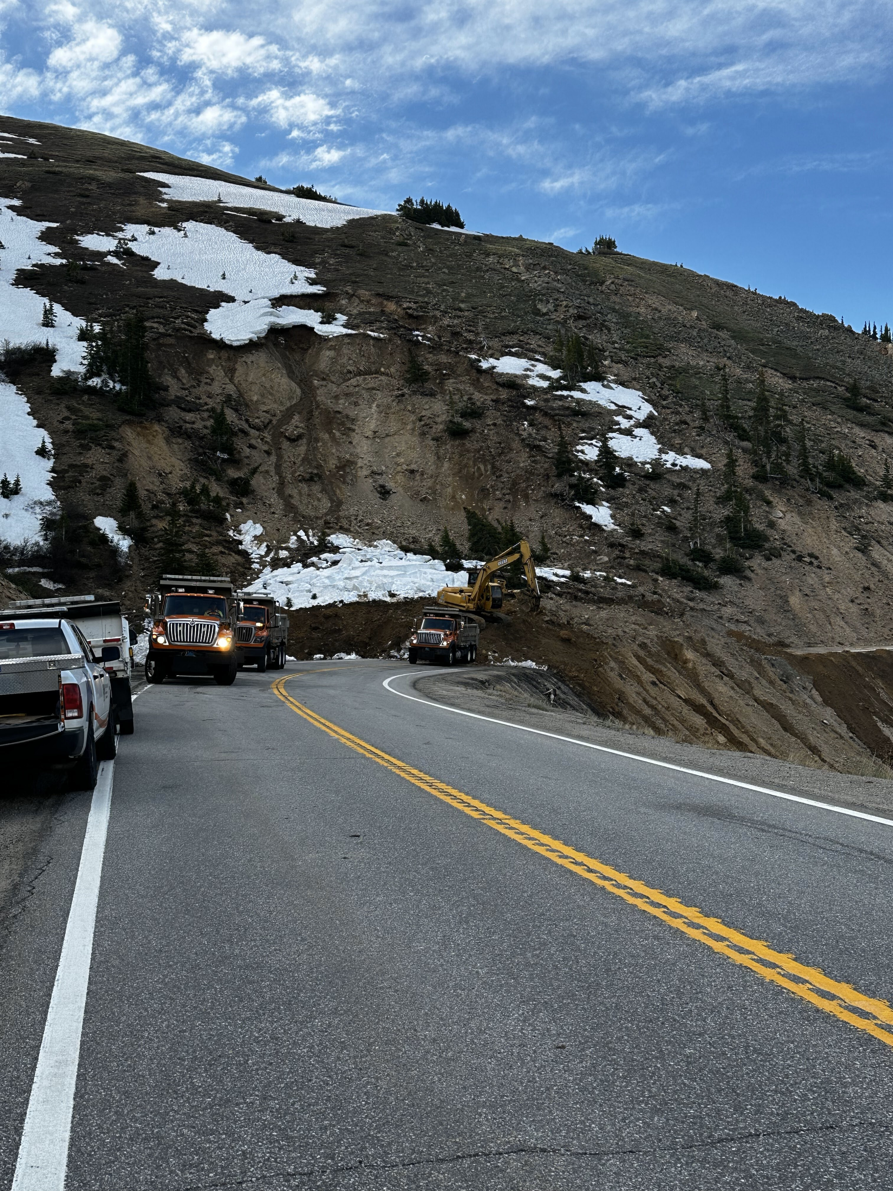 Heavy-duty trucks working to clear the debris from the Loveland Pass US 6 landslide from the morning 06172025.jpg detail image