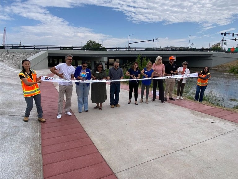Representatives from CDOT, City of Denver and Bicycle Colorado cut the grand opening ribbon for the new Alameda Avenue Bridge Project Representatives from CDOT, City of Denver and Bicycle Colorado cut the grand opening ribbon for the new Alameda Avenue Bridge Project on a new segment of the South Platte River Trail