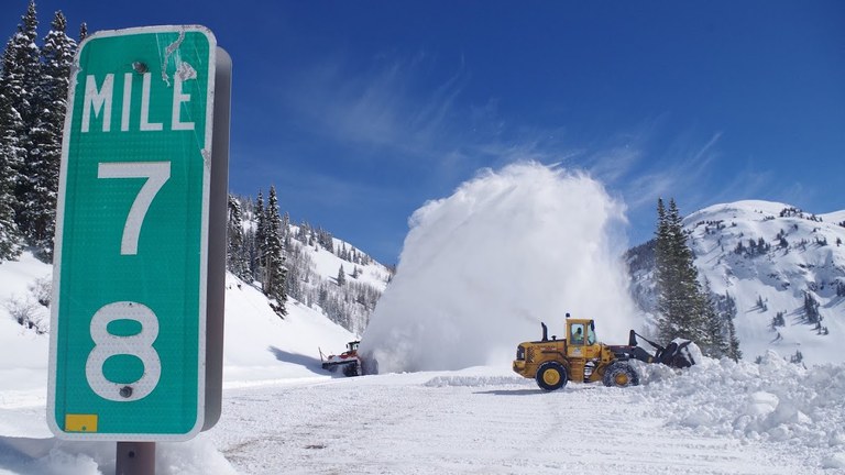 Snow operations on US 550 Red Mountain Pass. Signage for Mile Point 78 is in the foreground.