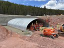 Wildlife underpass along highway construction with blue sky and forest scenery..jpg thumbnail image