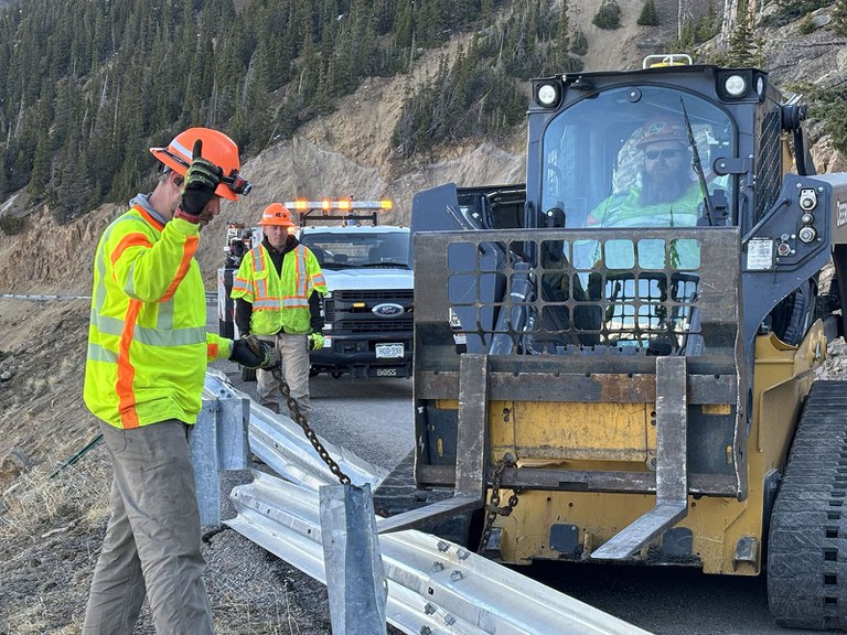 CDOT maintenance patrol workers repair damaged guardrail on the west side of the Independence Pass summit.