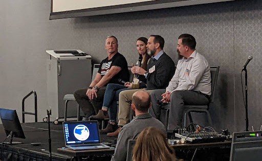 A group of panelists at the Region e Course event