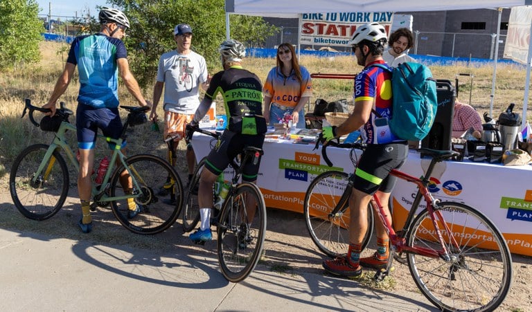 Bicyclists stop at CDOT's 2024 Bike to Work Day Station 