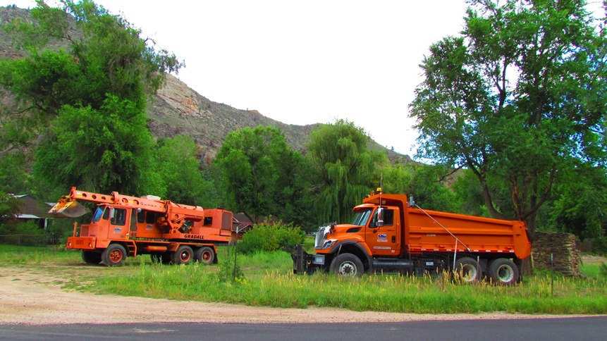 Tandem Axle Dump Truck and Grade-All detail image