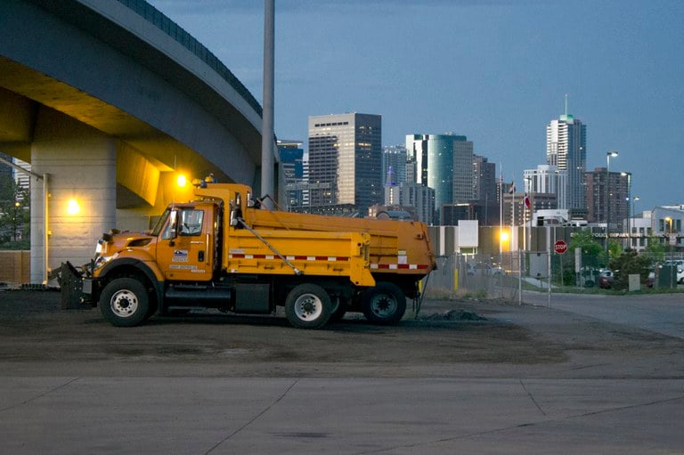 Snow Plow under a bridge near Denver