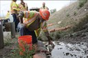 A CDOT environmental engineer collects samples to assess potential environmental impacts of bridge.jpg thumbnail image