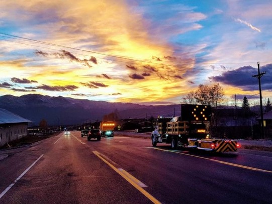 A group of CDOT trucks on a road at sunset - 4-3 aspect ratio.jpg detail image