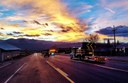 A group of CDOT trucks on a road at sunset.jpg thumbnail image