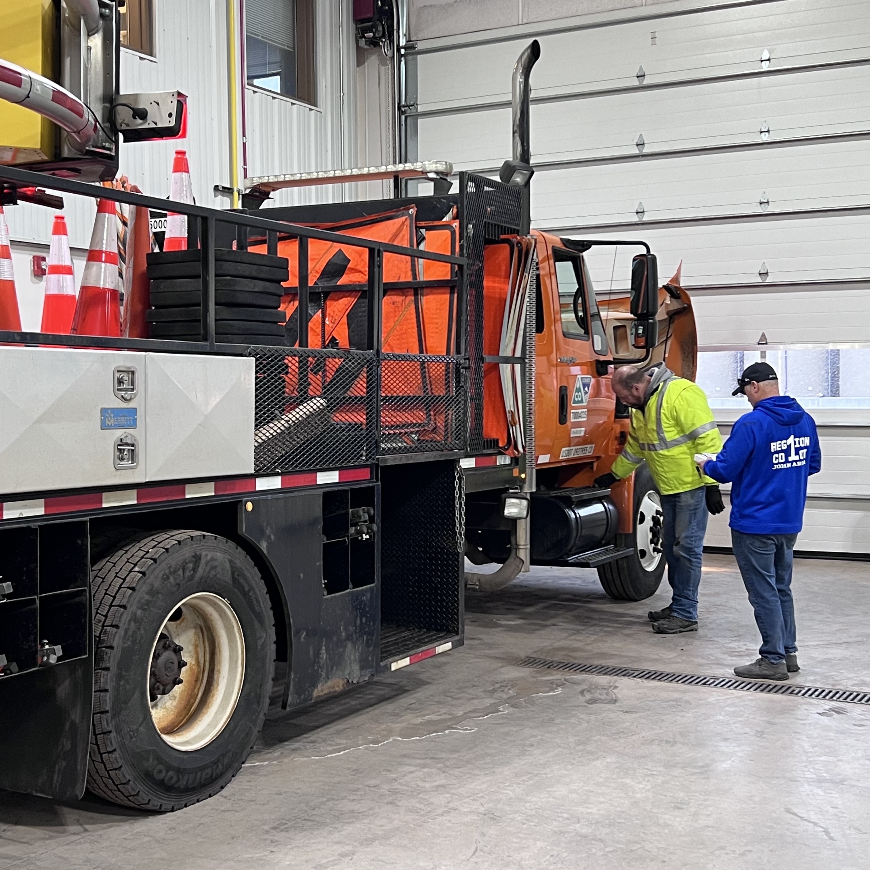 CDL trainers doing snowplow safety checks.jpg detail image