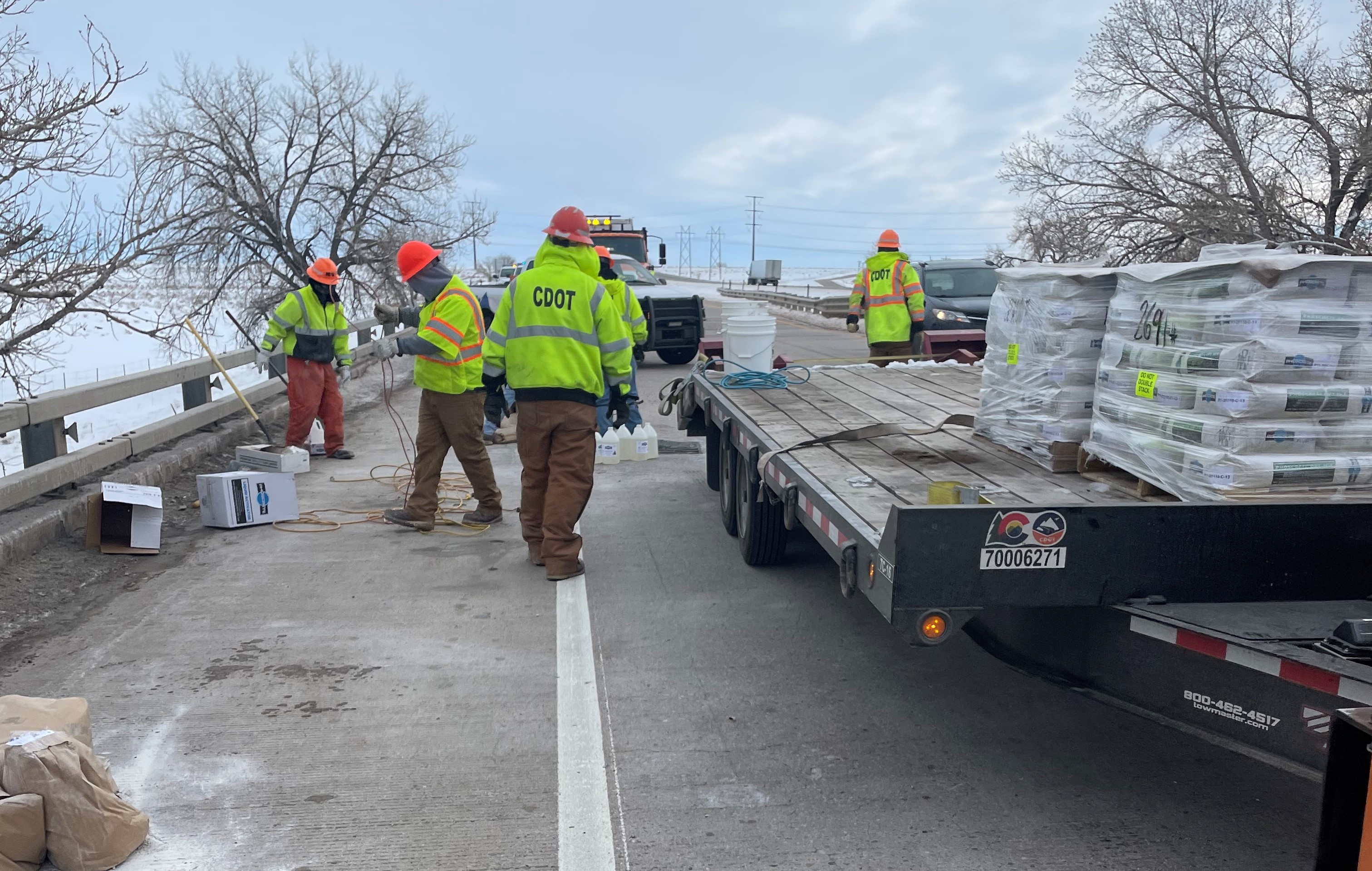 CDOT crews with truck and materials repairing bridge.jpg detail image