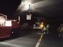 Light shines on a group of CDOT workers maintaining road conditions at night.jpg thumbnail image