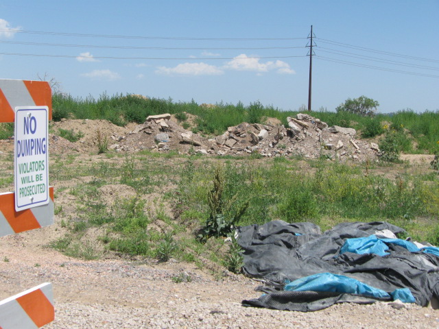 Debris piles at end of access road detail image