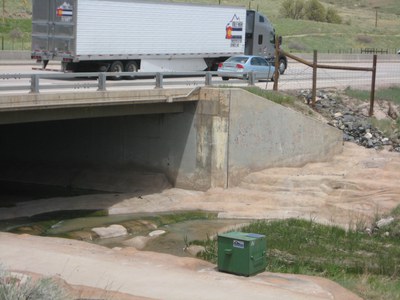 Wet Weathering Monitoring image View of green sampling security box located at the discharge point into live Colorado state waters.
