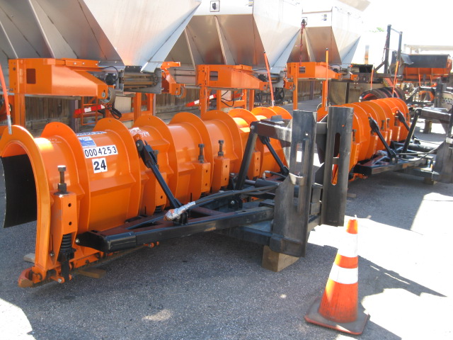Hydraulic hose attached to a snow plow blade detail image