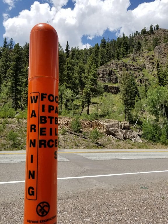 orange fiber marker with mountains in the background