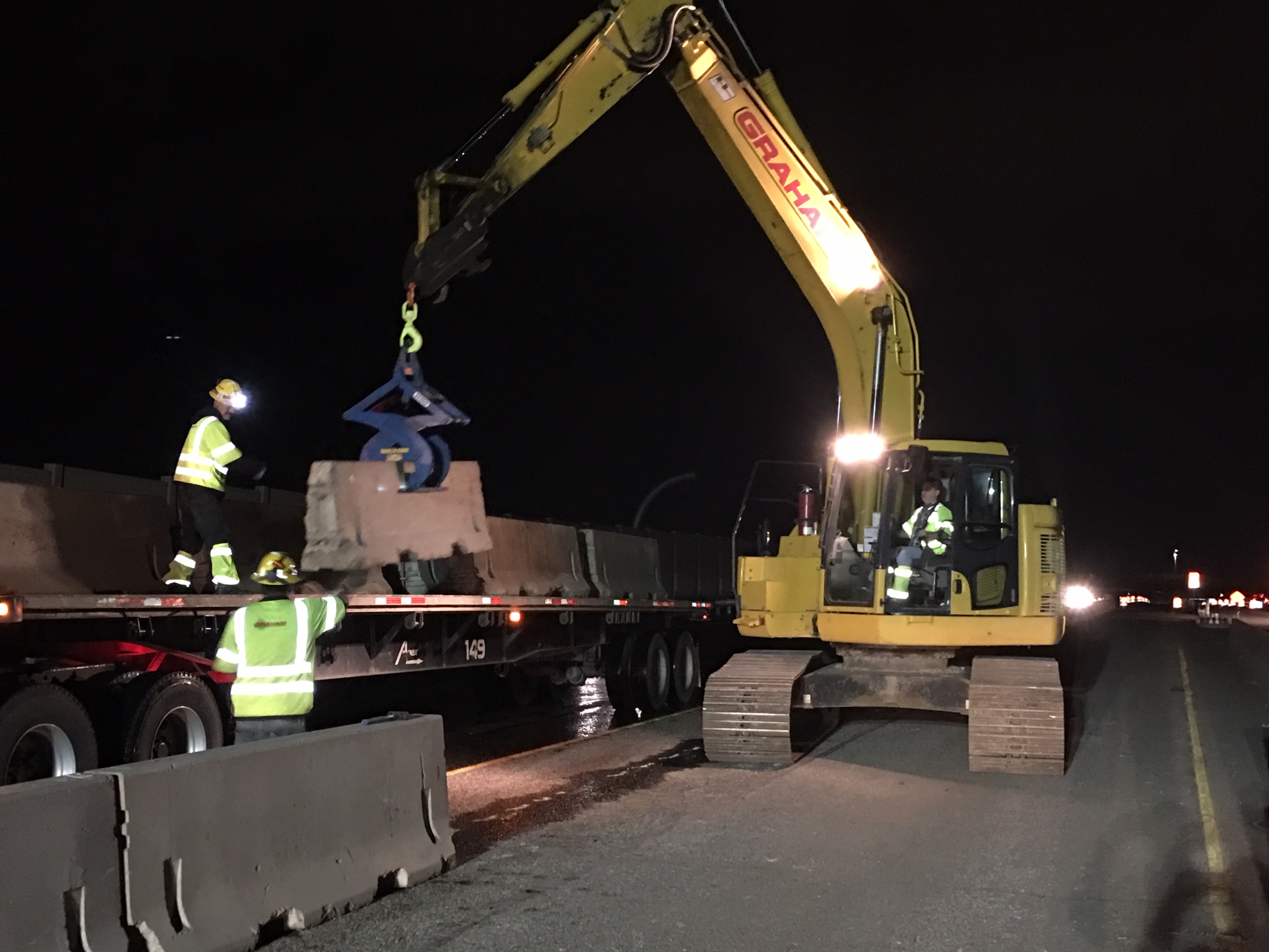 Crews installing temporary barrier detail image